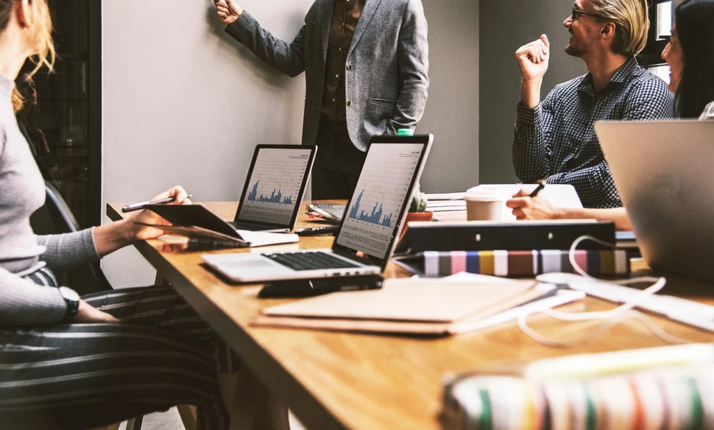 Two B2B marketers discussing lead generation vs demand generation strategies