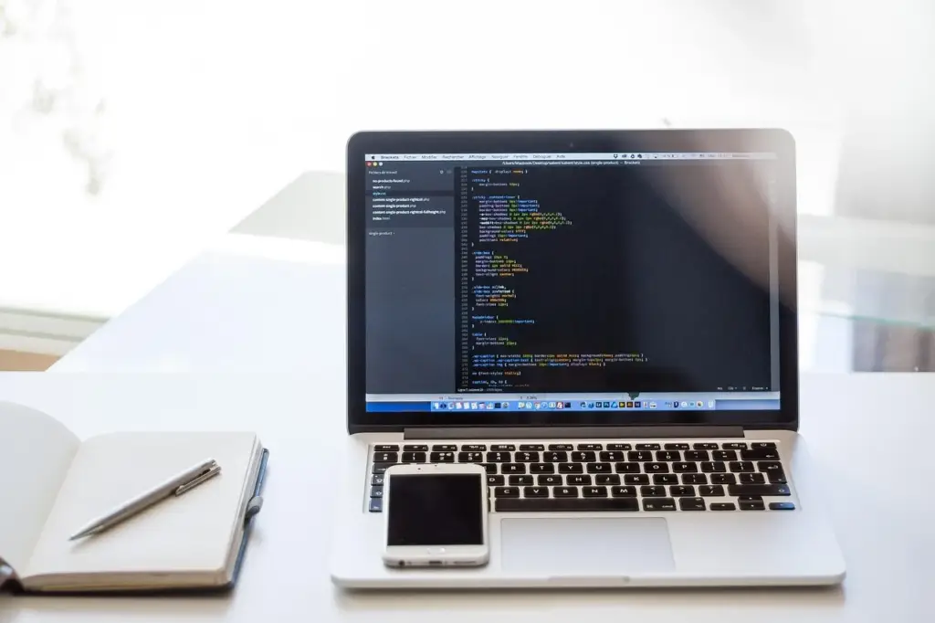 Marketing professional analyzing conversion tracking data on a laptop for B2B Google Ads