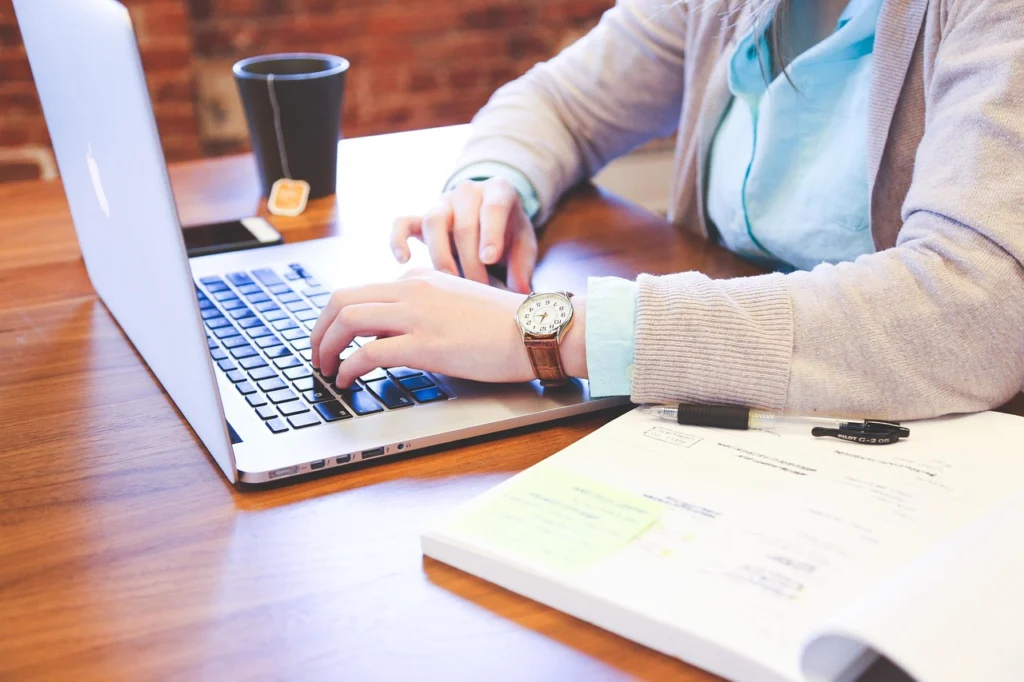B2B SEO keyword research on laptop with analytics dashboard